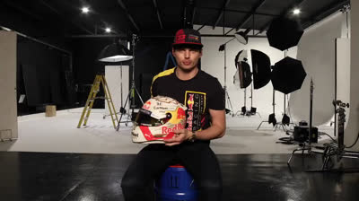 Max Verstappen shows his helmet