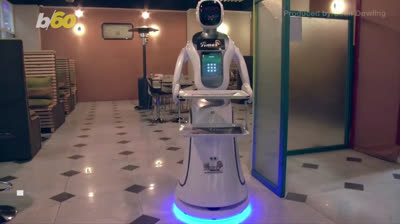 Polyglot Robot serves food in a restaurant in Kabul