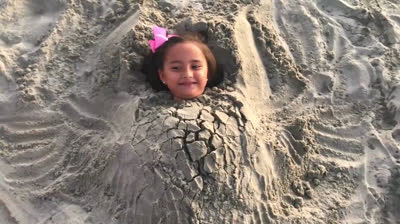 Playing sand burying