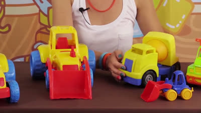 Playing with cars on the beach