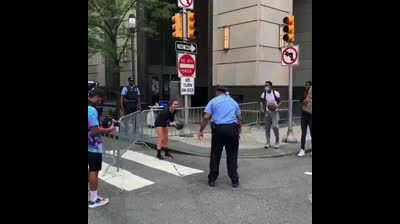 Protester and Police play basketball