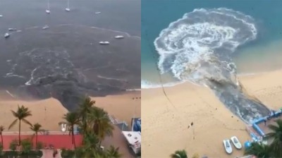 Arrojan vertidos en la playa de Acapulco en México que tiñen de negro el mar